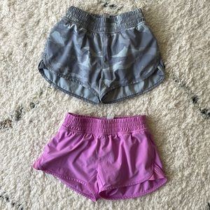 Two VGUC Athleta Girl 
Shorts 
Size XS 6
Pink and Camo